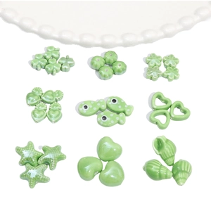 Green ceramic beads collection with clover pumpkin and shell shapes for jewelry making