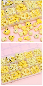 Macro detail of yellow ceramic cartoon beads in various shapes for DIY jewelry making