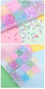 Macro view of 4mm colorful cat eye glass beads organized in a multi-grid storage box