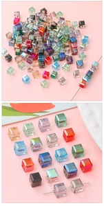 Macro detail of 8x8mm faceted square glass beads in multiple colors for DIY jewelry making