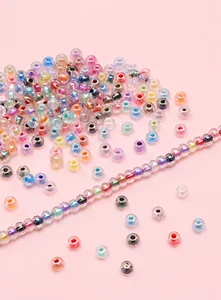 Macro detail of 4mm rainbow coated glass seed beads in pastel macaron colors for DIY