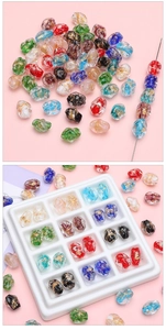 Macro detail of 10x14mm colorful handmade glass beads with gold foil foil accents