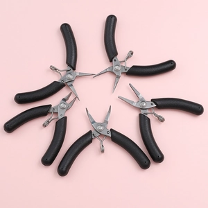 Five-piece DIY jewelry tool set with black ergonomic pliers on a pink background
