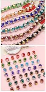 Macro view of 10mm glass beads with gold and silver foil inlays for DIY jewelry making
