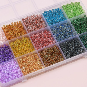 DIY jewelry kit with 4mm ink-patterned glass seed beads in a transparent plastic organizer