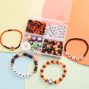 Halloween DIY bracelet kit with orange black beads and pumpkin ghost charms in a 4-grid box