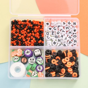 Halloween DIY bead kit with polymer clay charms and alphabet beads in a 4-compartment box