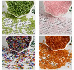 Macro detail of 2-4mm glass seed beads with AB coating in four vibrant pastel colors