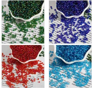Detail of 2mm AB colorful glass seed beads in peacock green, royal blue, red, and lake blue