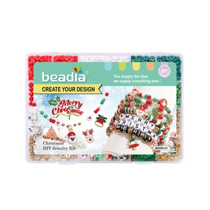 Christmas DIY jewelry making kit with red green beads and charms in a grid box
