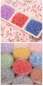 Macro view of multi-color 4mm faceted glass beads in trays for DIY jewelry making