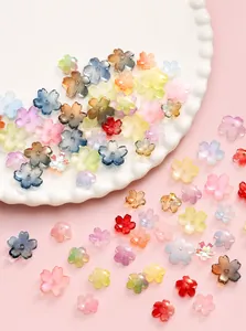 Macro shot of 3D cherry blossom beads in assorted macaron colors for DIY jewelry crafting