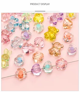Macro shot of colorful acrylic beads in bear and flower shapes for DIY jewelry making