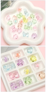 Close-up of candy-colored transparent acrylic bear and rabbit beads for DIY jewelry making