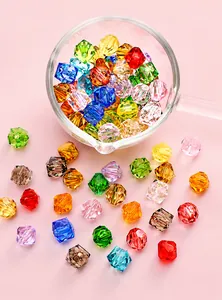 Macro shot of 10mm faceted acrylic geometric beads in mixed colors for DIY jewelry making