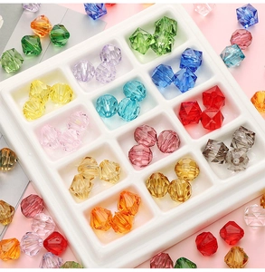 Macro shot of colorful 10mm faceted acrylic bicone beads for DIY jewelry making and crafts