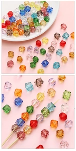 Macro view of multi-color faceted acrylic beads in bicone and cube shapes for DIY jewelry