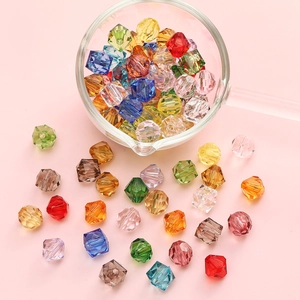 Colorful 10mm faceted acrylic beads for DIY jewelry making in a glass bowl