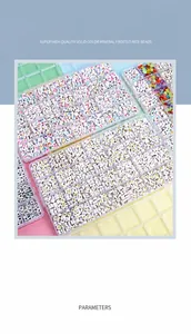 Acrylic alphabet beads set with gold and colorful letters in a clear plastic organizer box