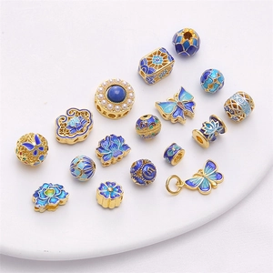 Exquisite 18K gold-plated cloisonne butterfly and lotus charms with blue enamel details