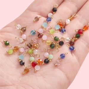 Faceted crystal glass ball pendants in various colors with gold loops for DIY jewelry