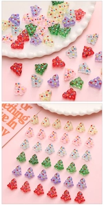 Colorful resin Christmas tree beads for DIY jewelry with decorative dots on pink backdrop