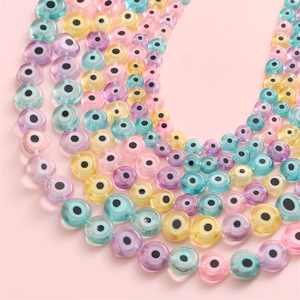 Flat round evil eye glass beads in pastel colors for DIY jewelry making and crafts