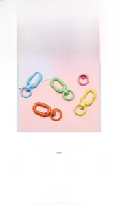 Macro shot of colorful matte alloy carabiner clips for DIY jewelry and keychains