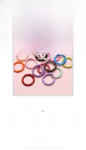 Close-up of 25mm alloy polka dot spring hooks in various colorful candy drip oil finishes