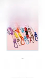 Macro shot of colorful woven nylon keychains with matching painted alloy metal carabiners