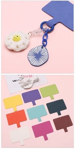 Detail view of colorful universal phone lanyard pads with handmade knit flower pendant