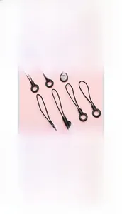 Close-up of black acrylic and nylon phone lanyards with circular buckles for DIY cases