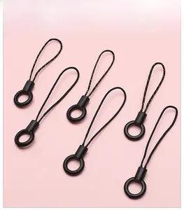 Set of six black circular phone lanyards with woven loops on a pink background