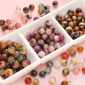 Faceted 10mm colorful natural stone beads for DIY jewelry making in a white sorting tray