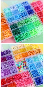 Colorful plastic pony beads in a transparent organizer box for DIY jewelry making
