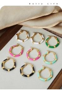 Detail of colorful enamel bamboo style hoop earrings in 18K gold plated titanium steel