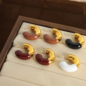 Polished C-shape hoop earrings with colorful enamel accents in four elegant colors