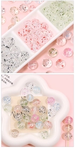 Macro shot of colorful acrylic round beads with glitter for DIY jewelry making
