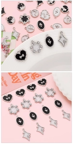Macro shot of vintage black and white enamel alloy charms for DIY jewelry making