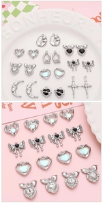 Macro view of silver alloy pendants including heart bow and moon styles for DIY jewelry