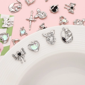 Assorted silver alloy charms with rhinestones and bowknot for DIY jewelry making
