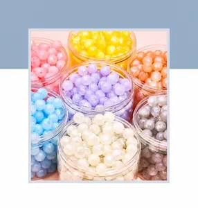 Macro detail of mixed pastel matte acrylic beads for DIY jewelry making and crafts