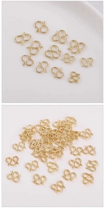 Macro detail of 14K gold-plated S-hook jewelry connectors for DIY necklaces and bracelets