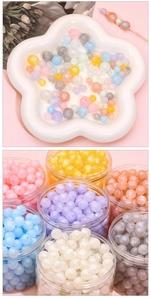 Macro detail of acrylic macarons beads with shimmer powder for DIY jewelry making