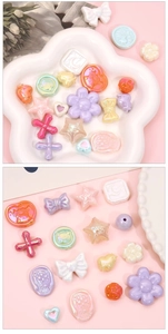 Detailed macro of iridescent macaron-colored resin charms for DIY jewelry making