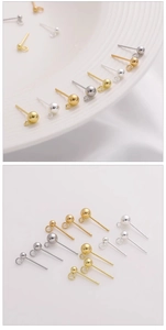 Detail of round ball stud earrings with hanging loops in gold and silver finishes