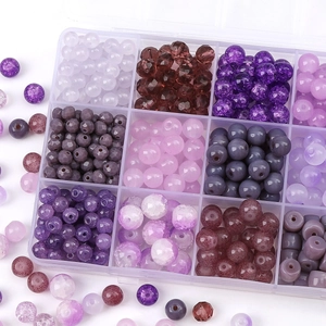 Purple DIY bead kit with various glass and resin beads in a 12-slot storage box