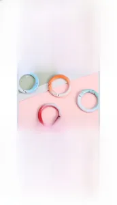 Close-up of matte gradient alloy spring O-rings for DIY bags and keychains