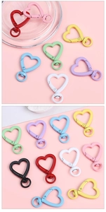 Macro detail of colorful heart-shaped alloy spring clasps for DIY jewelry making