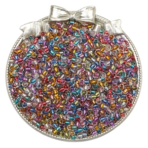 Colorful assorted 2/3/4mm glass seed beads in a decorative silver tray for DIY jewelry making